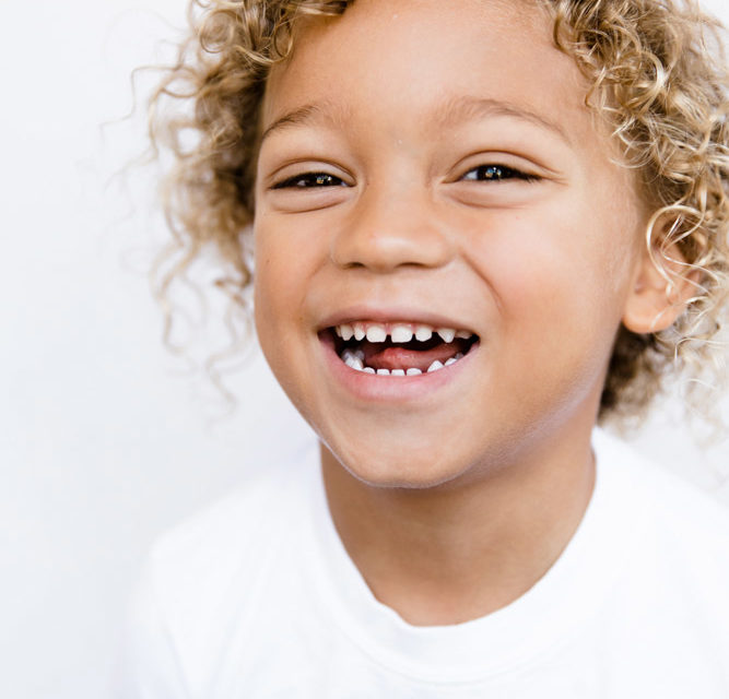 Child smiling at dentist