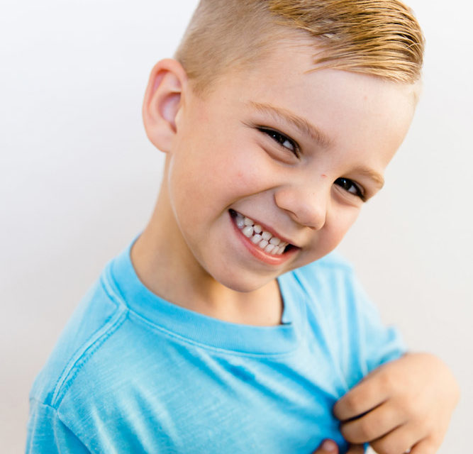 Boy smiling after dentist visit